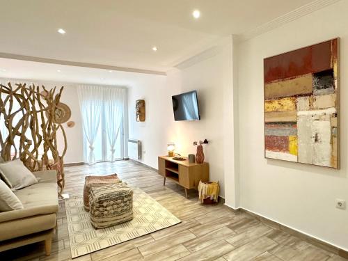 a living room with a couch and a table at Estudio con encanto en el casco, junto al puerto in Castro-Urdiales