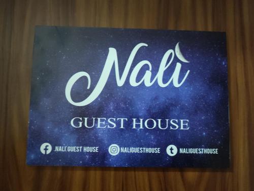 a sign with the name of a guest house at Nalí Guest House in Ercolano