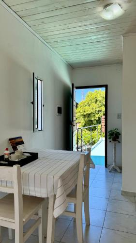 a dining room with a table and a view at La Pilar in Formosa