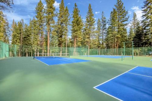 a tennis court with two tennis courts at Slope Side Studio in Northstar Village! in Truckee