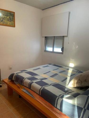 Ένα ή περισσότερα κρεβάτια σε δωμάτιο στο Apartamento San Juan