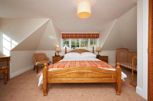 a bedroom with a bed and a window at Home Farm Cottages, Glendaruel, Argyll. Scotland in Clachan of Glendaruel