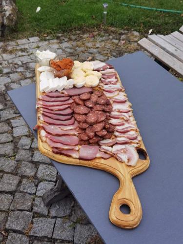 a tray of meat and other food on a table at Šumadijska panorama in Topola