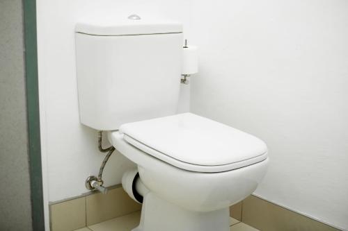 a bathroom with a white toilet in a room at Hidas serviced apartments in Windhoek