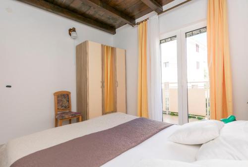 Posteľ alebo postele v izbe v ubytovaní Apartments Glorija