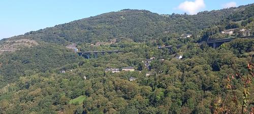 an aerial view of a mountain with a bridge at El Urogallo in Noceda