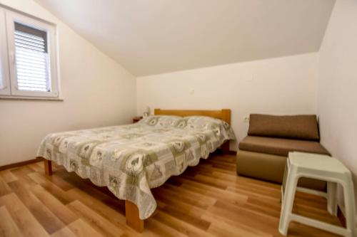 Giường trong phòng chung tại Apartments Ornella