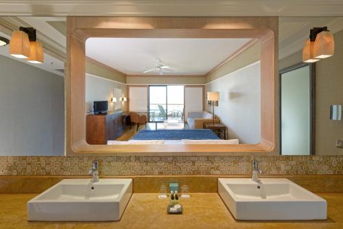 a bathroom with two sinks and a large mirror at Lykia World Links Golf Antalya in Denizyaka