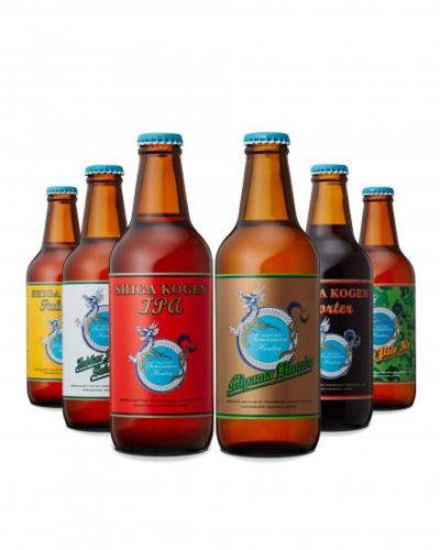 a group of six bottles of beer lined up at Shiga Kogen Lodge in Yamanouchi