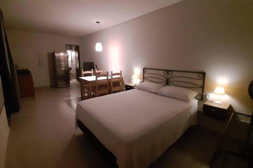 Кровать или кровати в номере Studio Pitangueiras