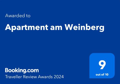 Et logo, certifikat, skilt eller en pris der bliver vist frem på Apartment am Weinberg