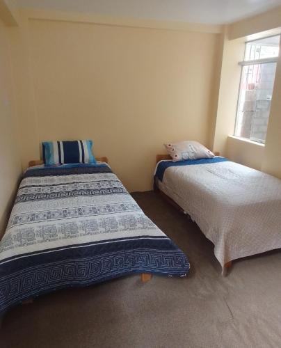 Postel nebo postele na pokoji v ubytování killa andina inn