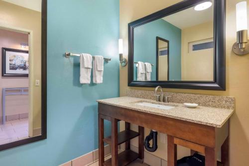 a bathroom with a sink and a mirror at Best Western Plus Beach View Lodge in Carlsbad
