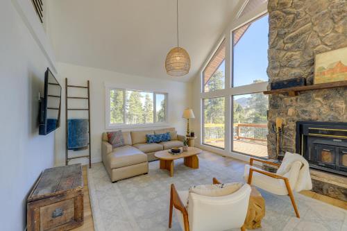 a living room with a couch and a fireplace at Spacious Black Hawk Home with Deck and Mountain Views! in Black Hawk