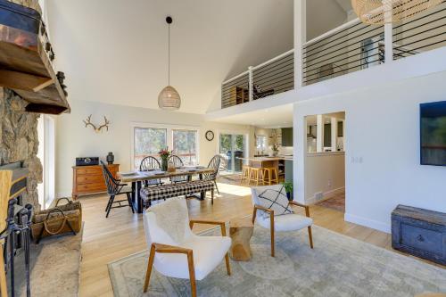a living room with a table and chairs at Spacious Black Hawk Home with Deck and Mountain Views! in Black Hawk