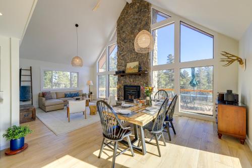 a dining room and living room with a table and chairs at Spacious Black Hawk Home with Deck and Mountain Views! in Black Hawk