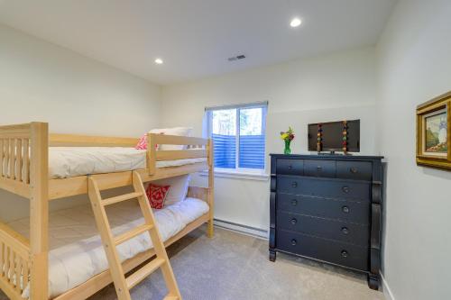 a bedroom with two bunk beds and a dresser at Spacious Black Hawk Home with Deck and Mountain Views! in Black Hawk
