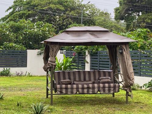 a couch in a gazebo in a yard at coral coast FIJI in Sigatoka