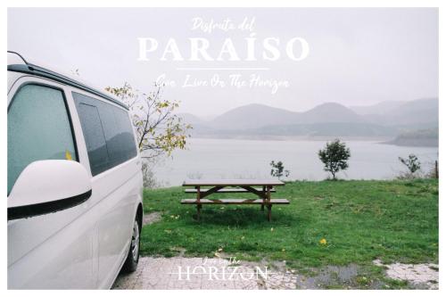 a van parked next to a picnic table at Live On The Horizon 2 in Ribadesella