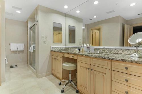 a bathroom with two sinks and a shower at The Galatyn Lodge in Vail