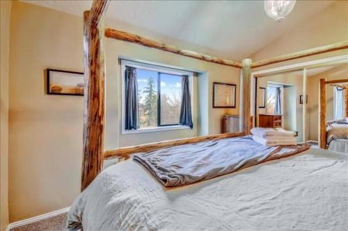 a bedroom with a bed and a window at Eola Crest Farmhouse in McMinnville