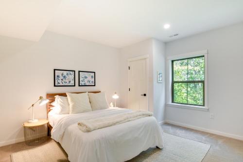 a white bedroom with a large bed and a window at The Linden, large & luxurious Galena escape! in Galena