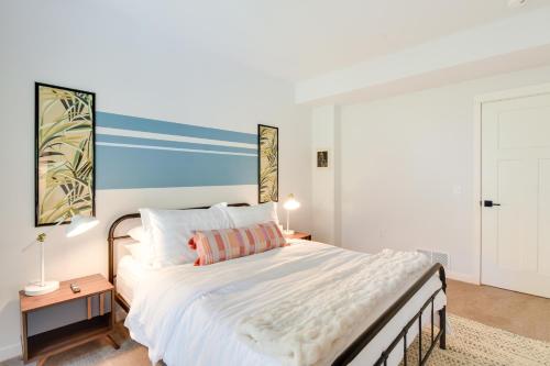 a bedroom with a large white bed and a table at The Linden, large & luxurious Galena escape! in Galena