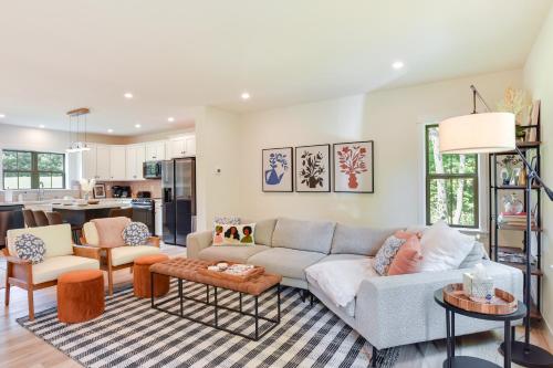 a living room with a couch and a table at The Linden, large & luxurious Galena escape! in Galena
