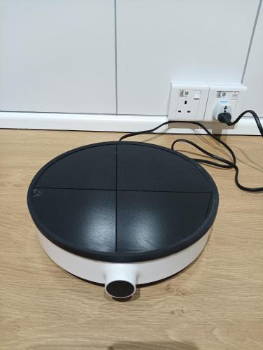 a computer mouse sitting on top of a table at rumaKL at Majestic Maxim in Kuala Lumpur