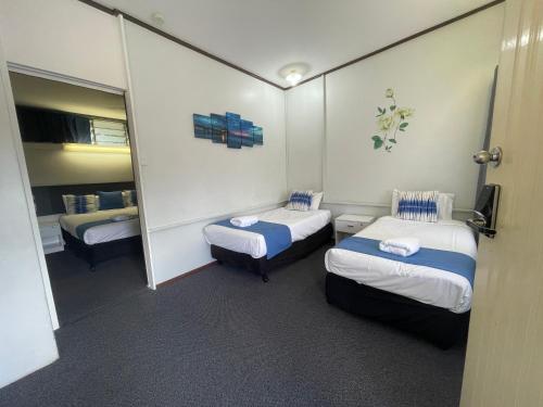 Postel nebo postele na pokoji v ubytování Arkana Motel