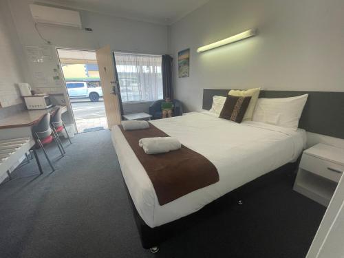 Postel nebo postele na pokoji v ubytování Arkana Motel