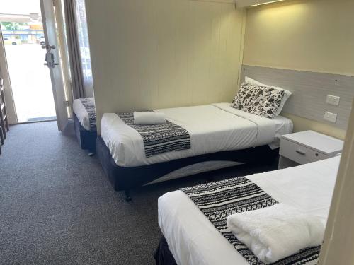 Postel nebo postele na pokoji v ubytování Arkana Motel