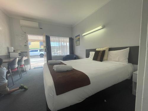 Postel nebo postele na pokoji v ubytování Arkana Motel
