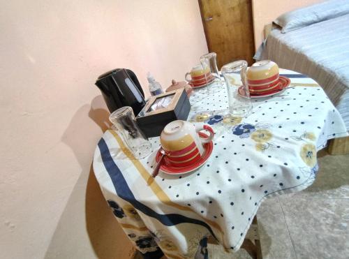 a table with hats on top of a table at La Casa de Lila in Tilcara