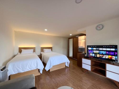 Кровать или кровати в номере Ciater Dream Village