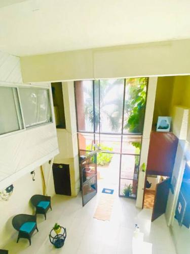 a view of a room with two blue chairs and a room with a view at Villa Caribe Cancún in Cancún