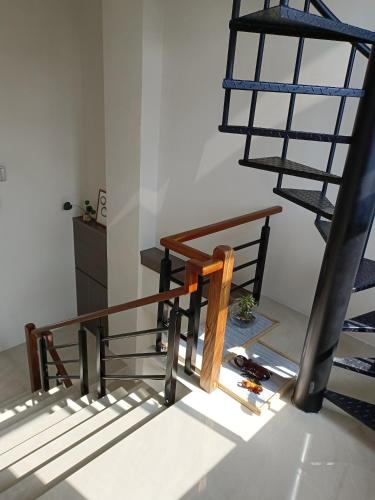 a set of stairs in a room with a ladder at 日日和 in Tainan