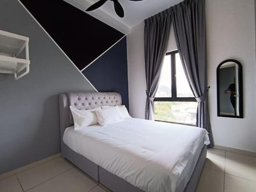 a bedroom with a white bed with a window at The Horizon Ipoh 2BR L8 by Grab A Stay in Ipoh