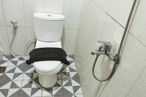 a bathroom with a toilet and a shower at Hotel Solaris Malioboro in Jetis