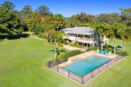 an aerial view of a house with a swimming pool at Blair Downs Farm Country Retreat in Cootharaba