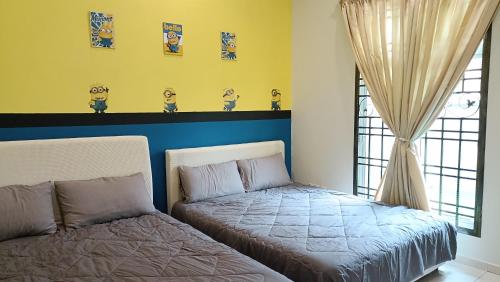 a bedroom with a bed next to a window at Melaka Homestay with pool 4BR Semi-D,BBQ,KTV,Billiard 15pax DeStarryVilla in Malacca