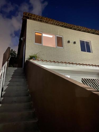 a stairway leading up to a house with a building at New House Temporada in João Pessoa