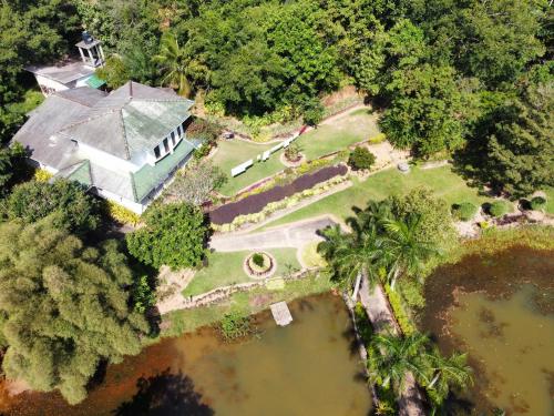 an aerial view of a house with a pond at Madikale Resort in Mirigama