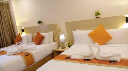 Cama ou camas em um quarto em bintang hotel
