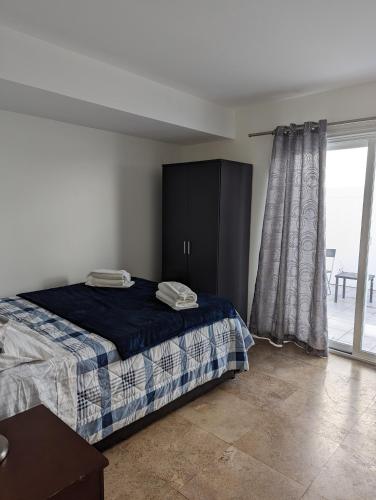 a bedroom with a bed and a sliding glass door at 2Bedroom with Den and 2BA 4 Blocks to Santa Monica Beach in Los Angeles