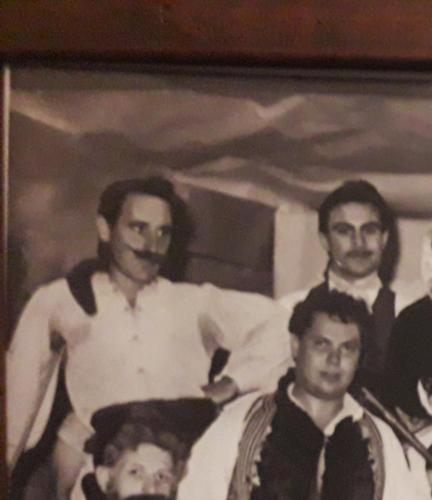 a black and white photo of three men in a picture at HELLAS PALACE ROOMS balcony in Sparti