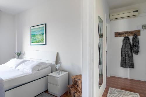 a white bedroom with a bed and a shower at LA MAR Apartment Spinea in Spinea