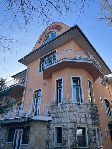 a building with a dome on top of it at Hotel Kristal in Budapest