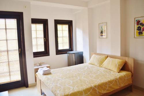 Ένα ή περισσότερα κρεβάτια σε δωμάτιο στο Villa Dudanov