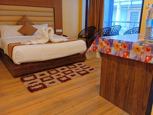 Ein Bett oder Betten in einem Zimmer der Unterkunft Royal Villa Beach Resort